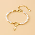 Auden Clé Letterbedel Armband in Goud