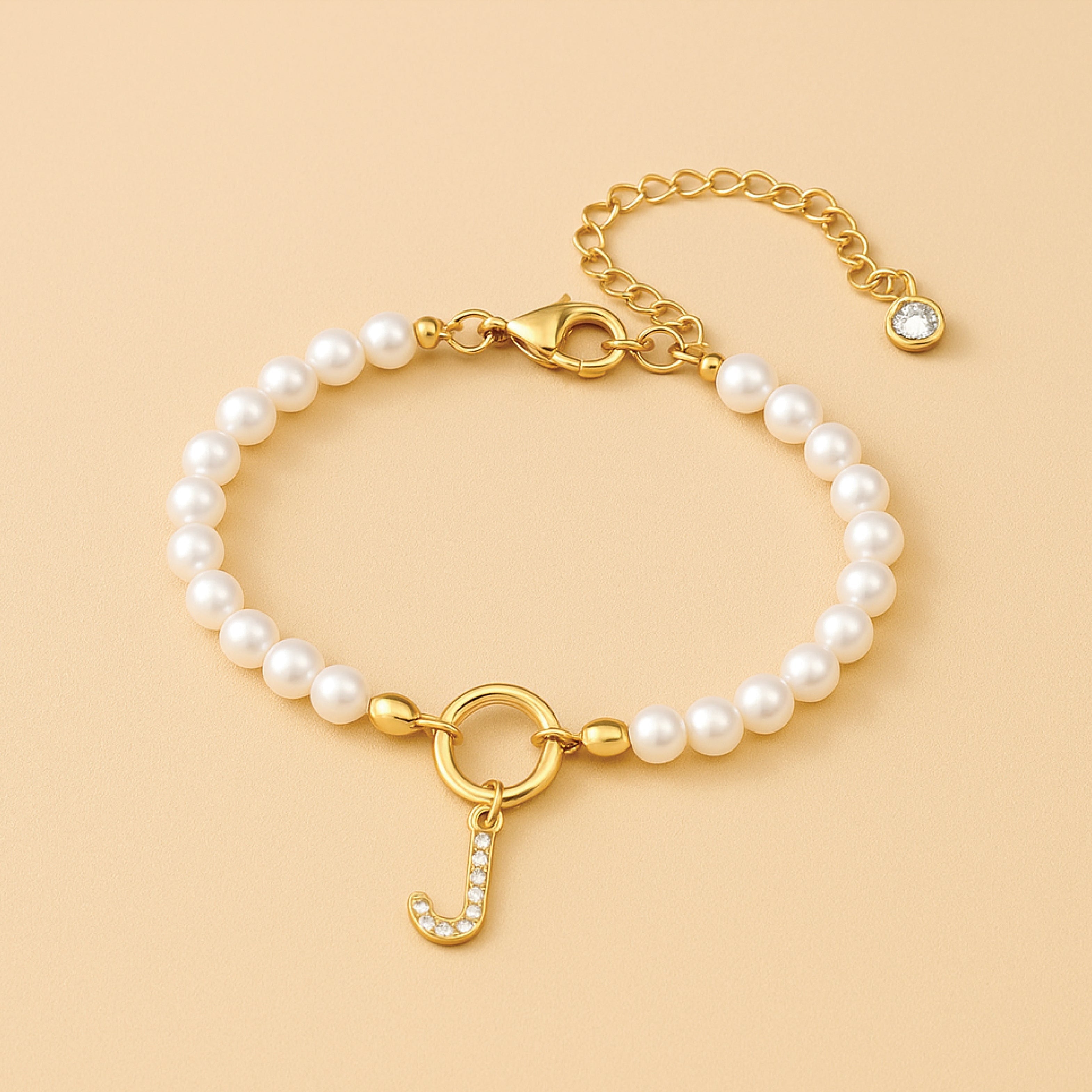 Auden Clé Letterbedel Armband in Goud