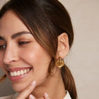 Statement ineengrijpende oorbellen | Goud